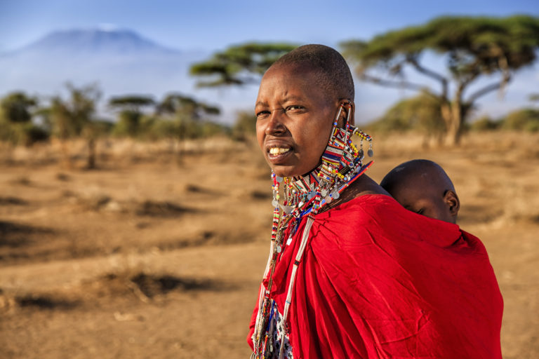African woman carrying her baby