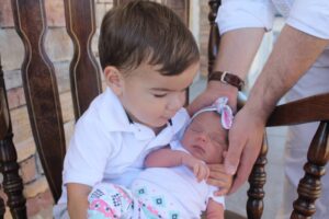 Mr. Mosher's grandchild, Cenzo, with his newborn sister, Rosie Mr. Mosher's grandchild, Cenzo, with his newborn sister, Rosie